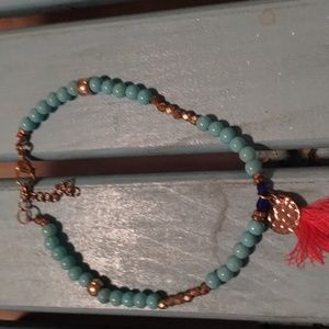 Blue gold and pink tassel bracelet
